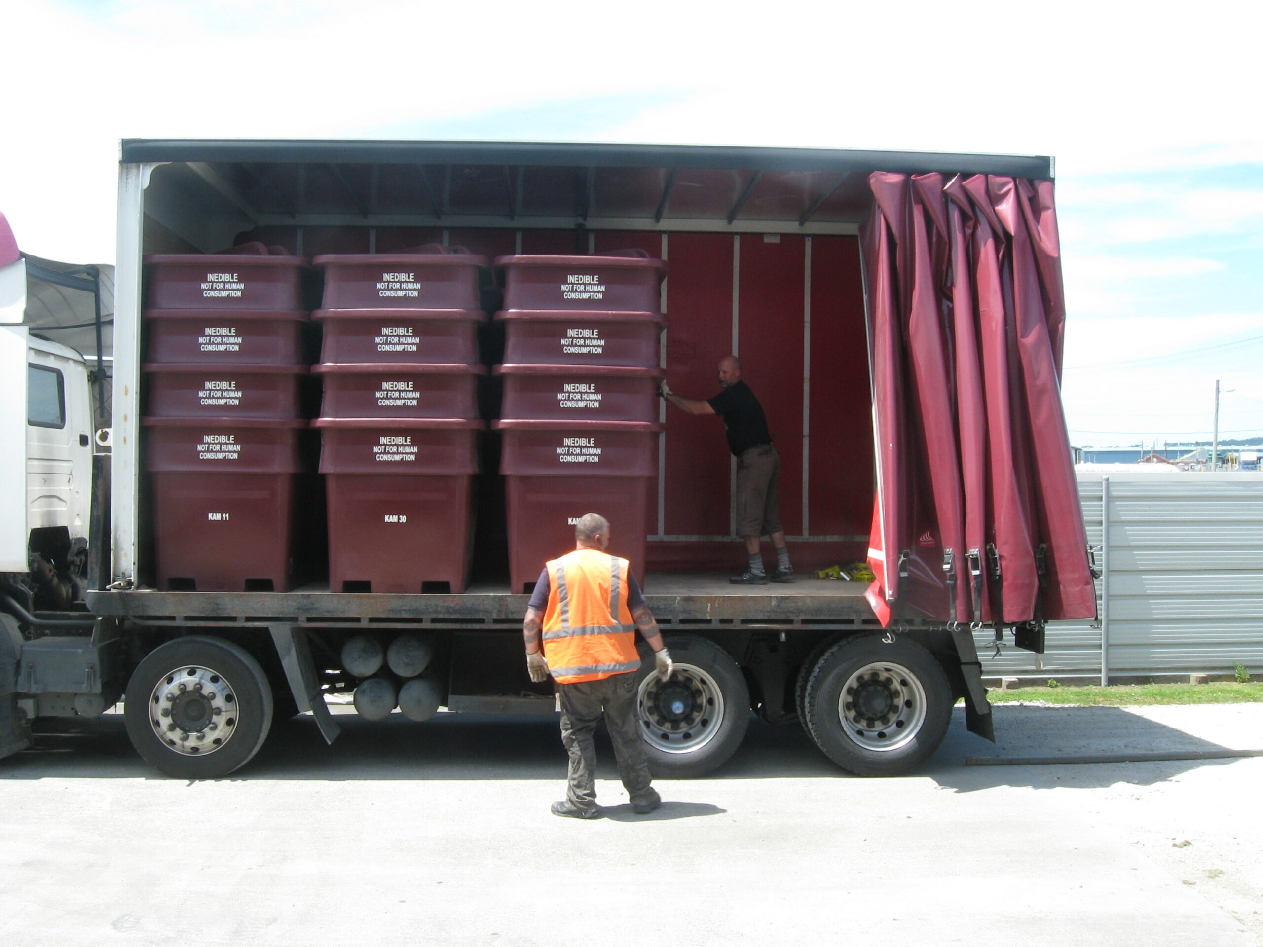 plum offal bins loaded on truck
