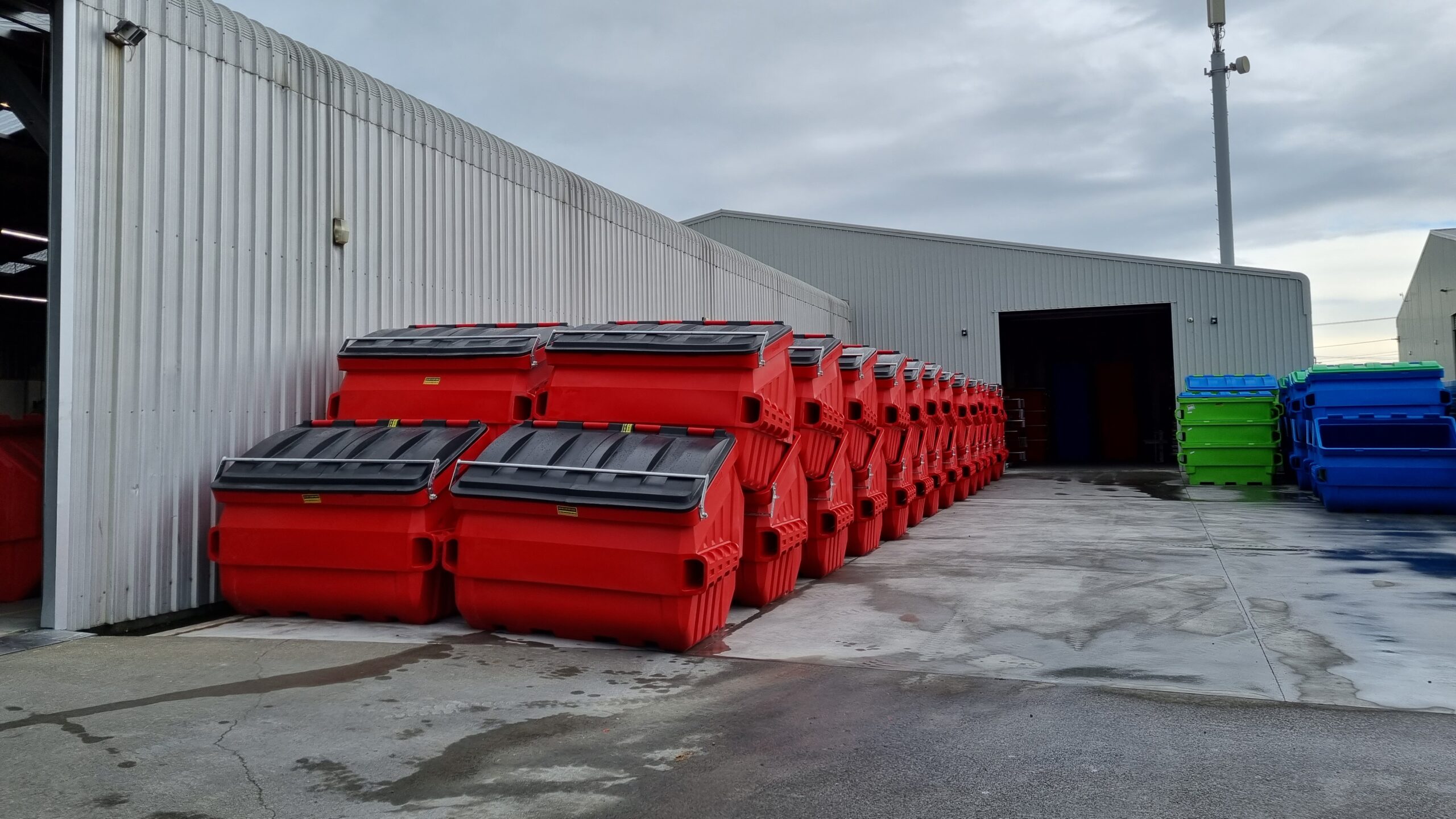 red front end loading skip bins Plast-ax